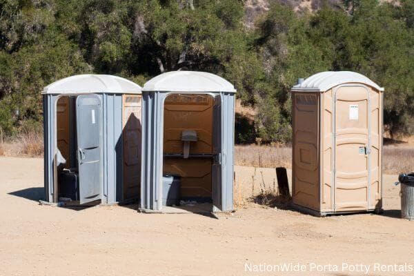 a clean row of portable restrooms for outdoor weddings or festivals in New Kent, VA